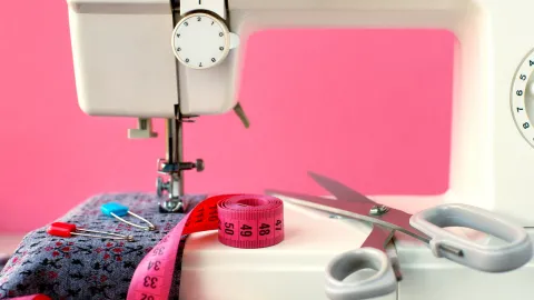 Sewing machine, fabric, measuring tape, and scissors