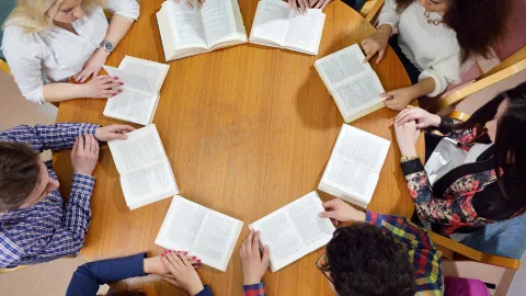 Group of teens reading