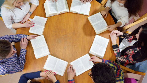 Group of teens reading